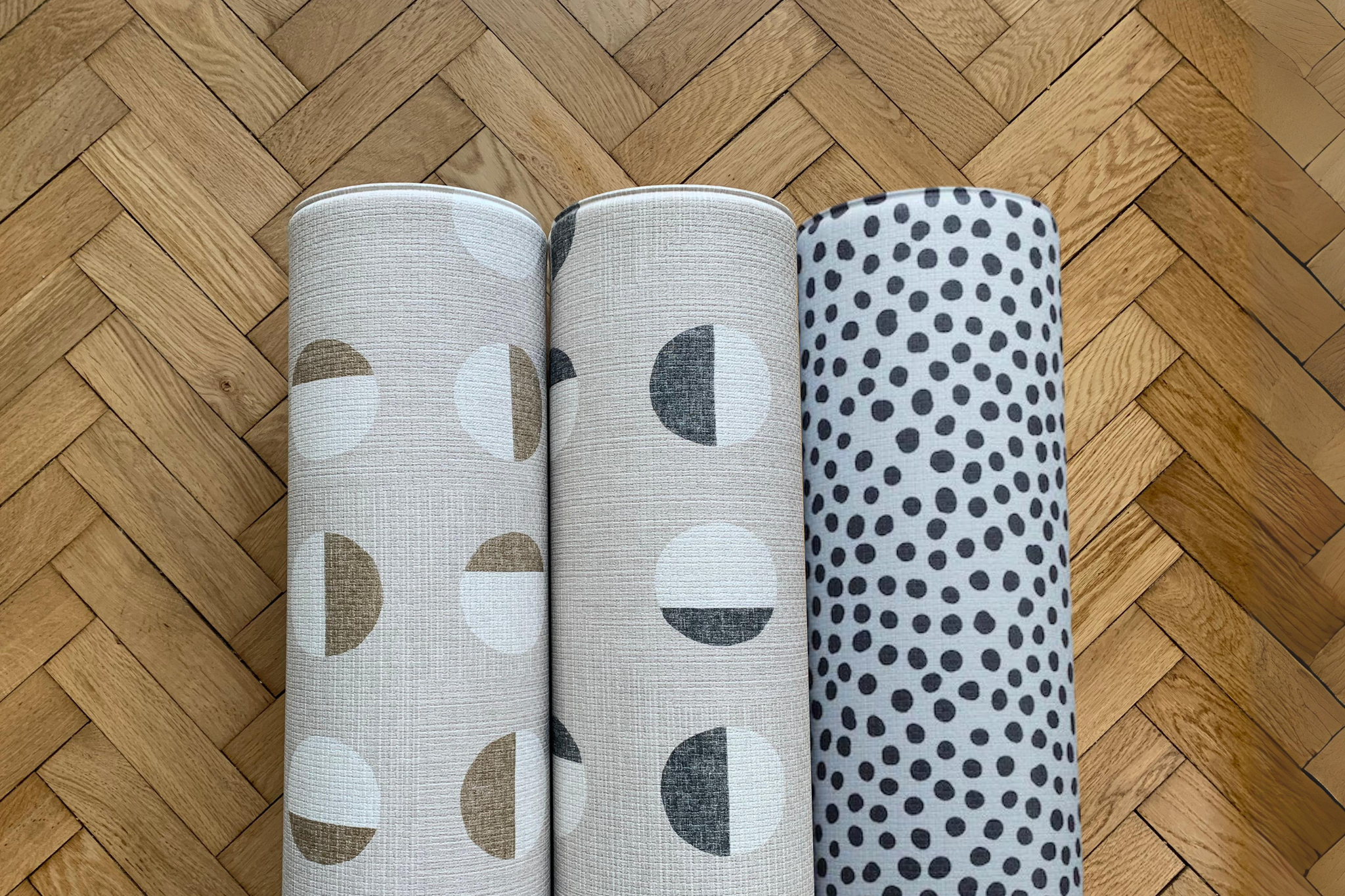 Three playful abstract design patterns on Totter and Tumble foam crawling mats to suit style conscious parents.