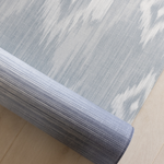 Close up of Large playmat for family home with Ikat design in soft blue and beige shades with memory foam to protect tumbles