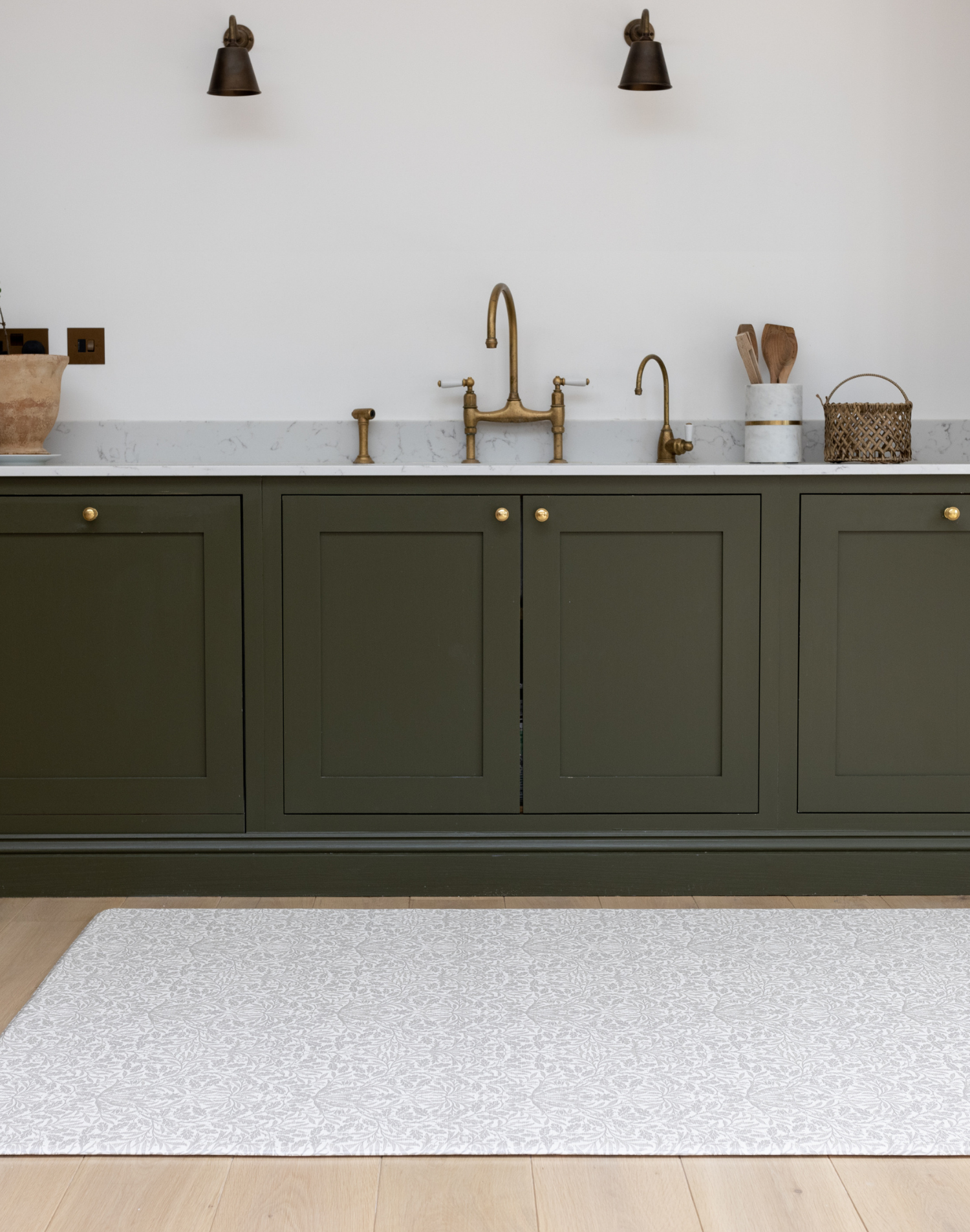totter and tumble playmat that looks like a rug to fit in with your home decor and interior style padded and comfortable underfoot, one piece and easy to clean play mat designed to be left in situ. the Acorn grey print is from our Morris & co collection