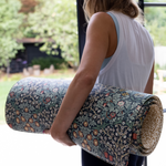mum carrying totter + tumble playmat into garden can be used outdoors for playing or exercise mum yoga and pilates mat
