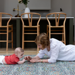 totter + tumble baby and granny playing on thick padded playmat that looks like a rug totter and tumble stylish one piece reversible designs make great presents for christmas, birthdays, baby showers and wedding gifts