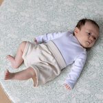 totter and tumble brer rabbit round playmat with baby relaxing on padded foam playmat for toddlers, best baby playmat rug comfy for tummy time and wipeable playmat for any spills or dribbles