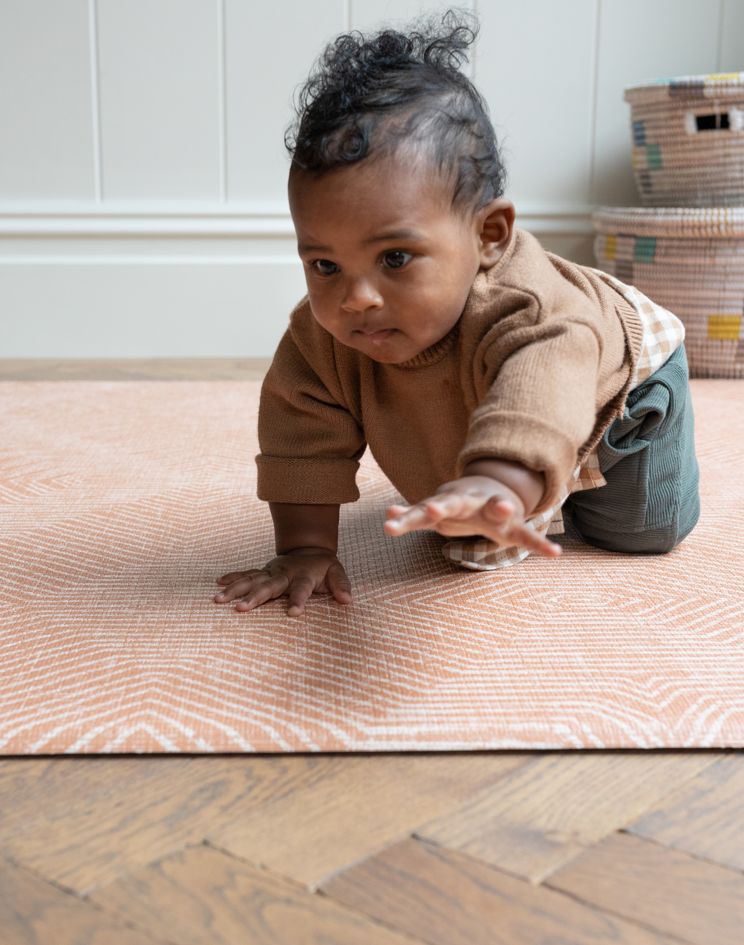 Brothers play on the terracotta tumble rug by totter and tumble with a thick design to protect tumbles