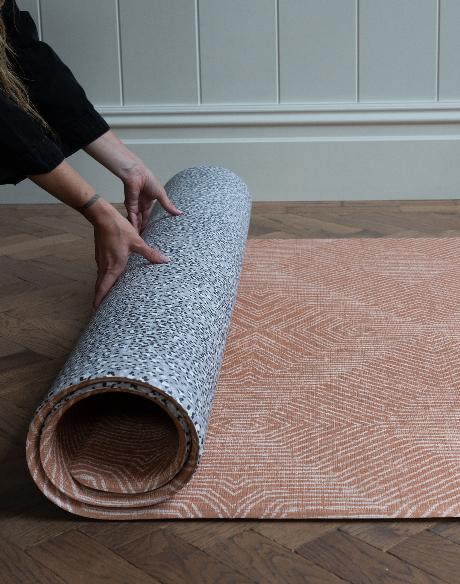 Hands unroll padded play mat designed to support babies and look stylish in the modern family home