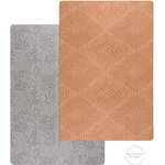 two sides of the reversible and padded play mat designed to support babies and look stylish in the modern family home