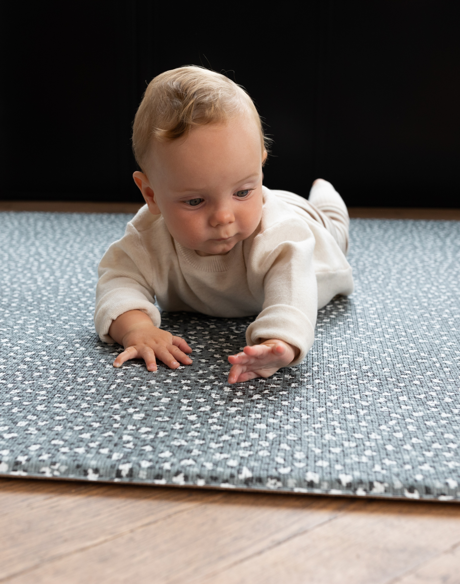 Baby tummy time on baby activity mat with a luxury padded memory foam design