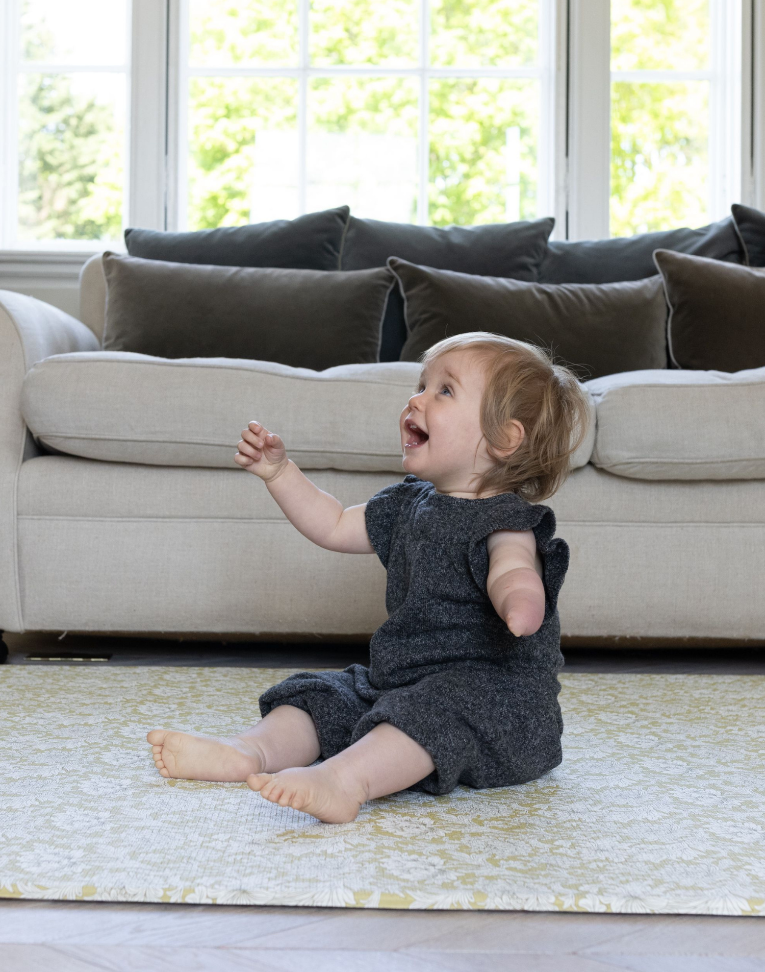 happy baby playing on totter and tumble play mat morris & Co padded foam playmat rug great for sitting, crawling, walking and makes a great large play mat that can be used for pilates or post natal exercise