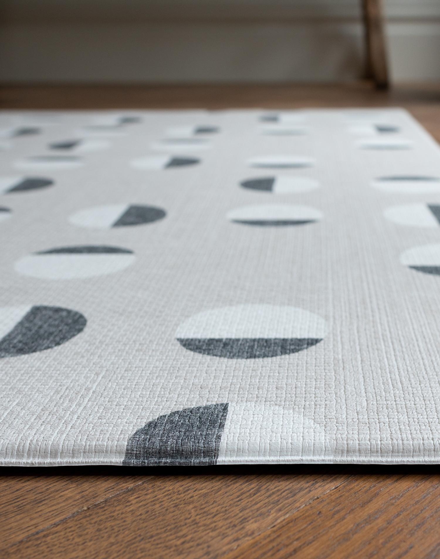 Close up of textured baby play mat with a modern polka design for a stylish effect