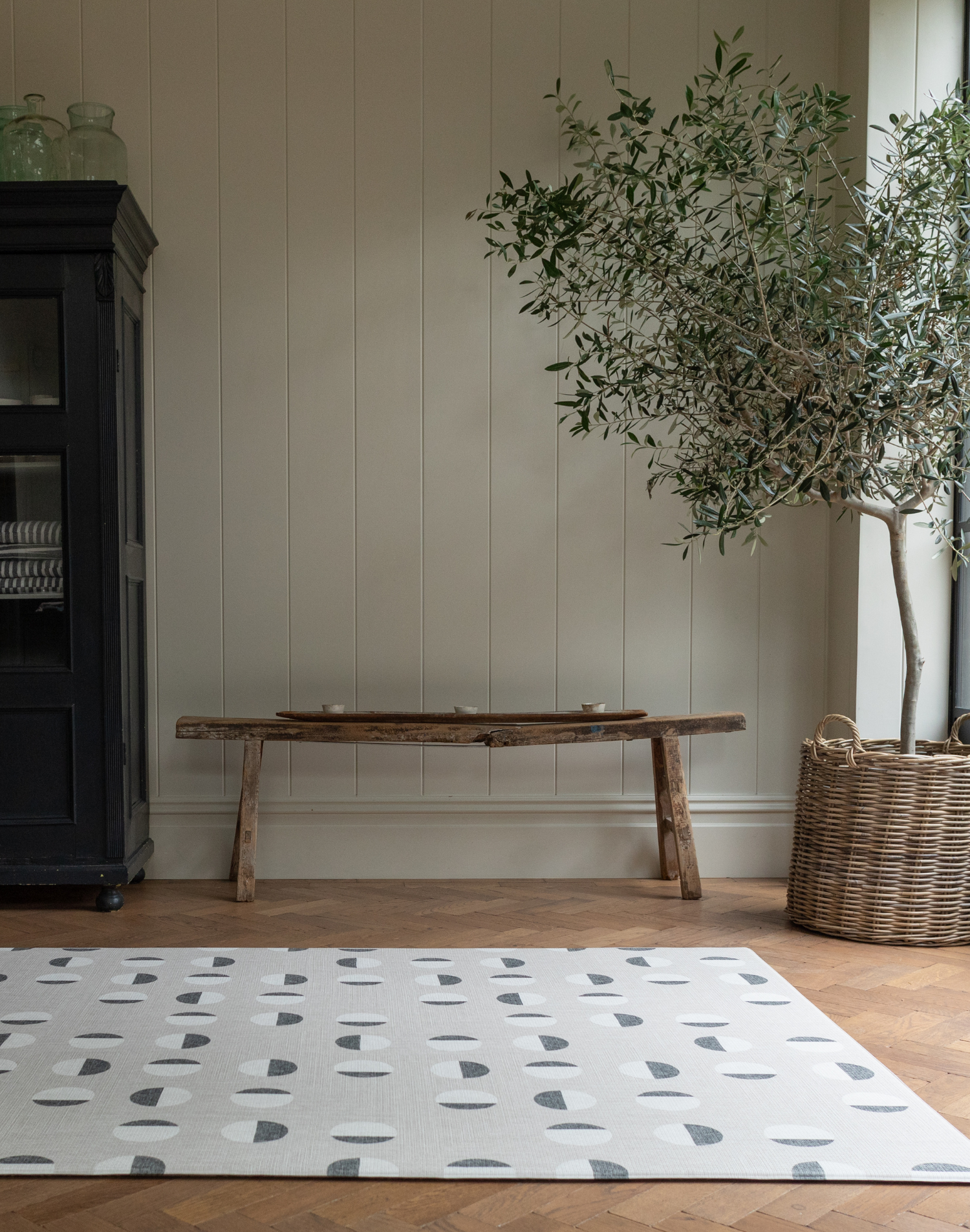 Monochrome play mat with organic polka design that complements contemporary family homes