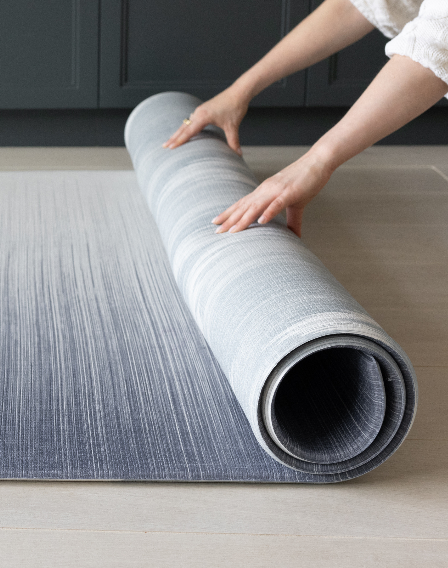 Unrolling Navy blue play mat with ombre gradient design unroll in family homes for ultimate comfort