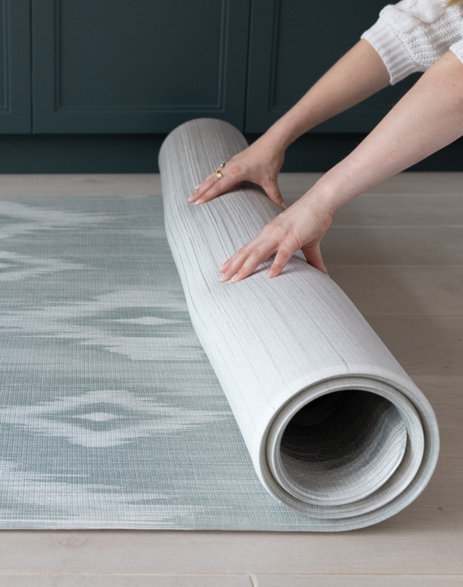 Unrolling beautiful baby play mat designed to look stylish in family homes with ikat design