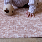 Baby hands are supported on the thick memory foam Rusa playmat allowing little ones to enjoy floortime play in comfort