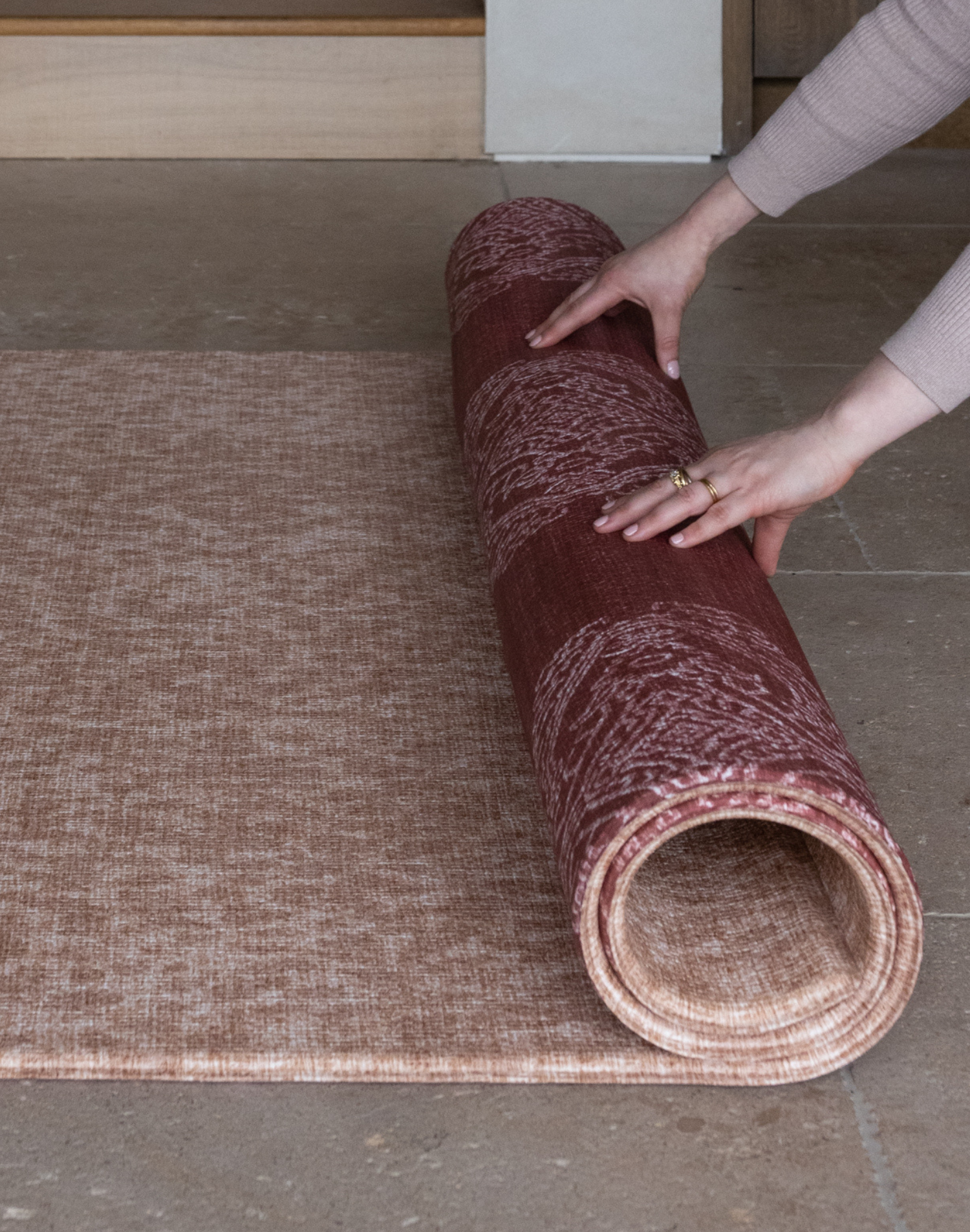 Unrolling reversible one piece playmat the Rusa and Merah with two timeless designs to complement modern interiors thick memory foam provides protection on hard flooring