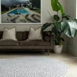 Extra large round kids playmat sits stylishly in a modern family living space