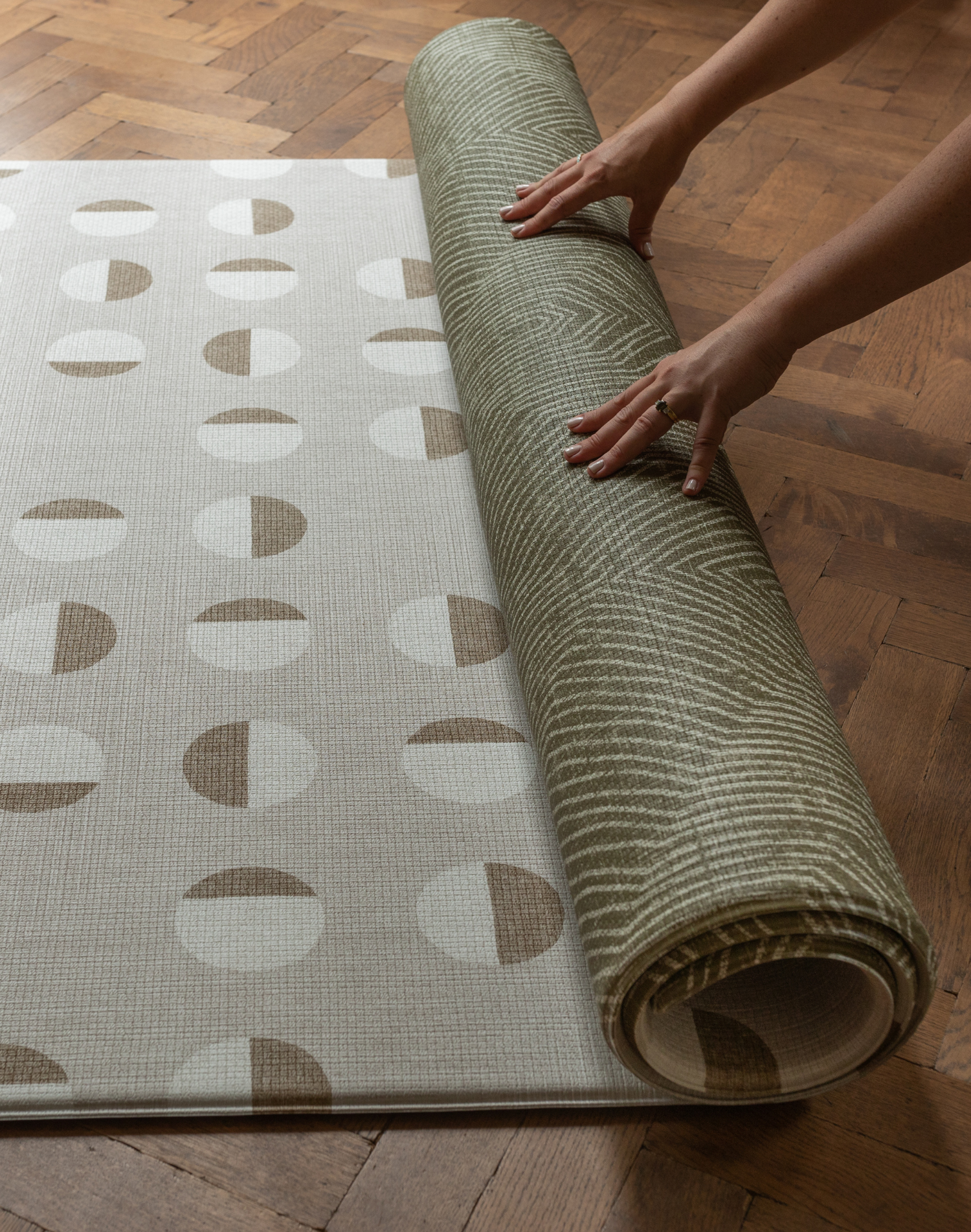 Unrolling memory foam one piece play mat for no stress play time in the home