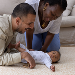 happy family moments on totter and tumble playmat dad mum and baby enjoy playing together on morris & co totter and tumble standen print, one piece, stylish, padded playmats that look like a rug