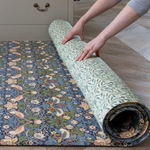 double sided totter and tumble play mat in Morris & Co. strawberry thief and Willow boughs designs. Non toxic padded playmats perfect for tummy time