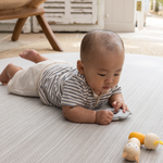 Tummy time on Beautiful baby play mat made from thick memory foam for supportive floor play with tan and beige stylish design