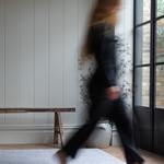 Figure walks across the stylish, anti-slip foam playmat by totter and tumble with a modern grey design