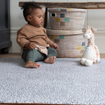 Baby boy plays on leopard print baby playmat designed with thick memory foam