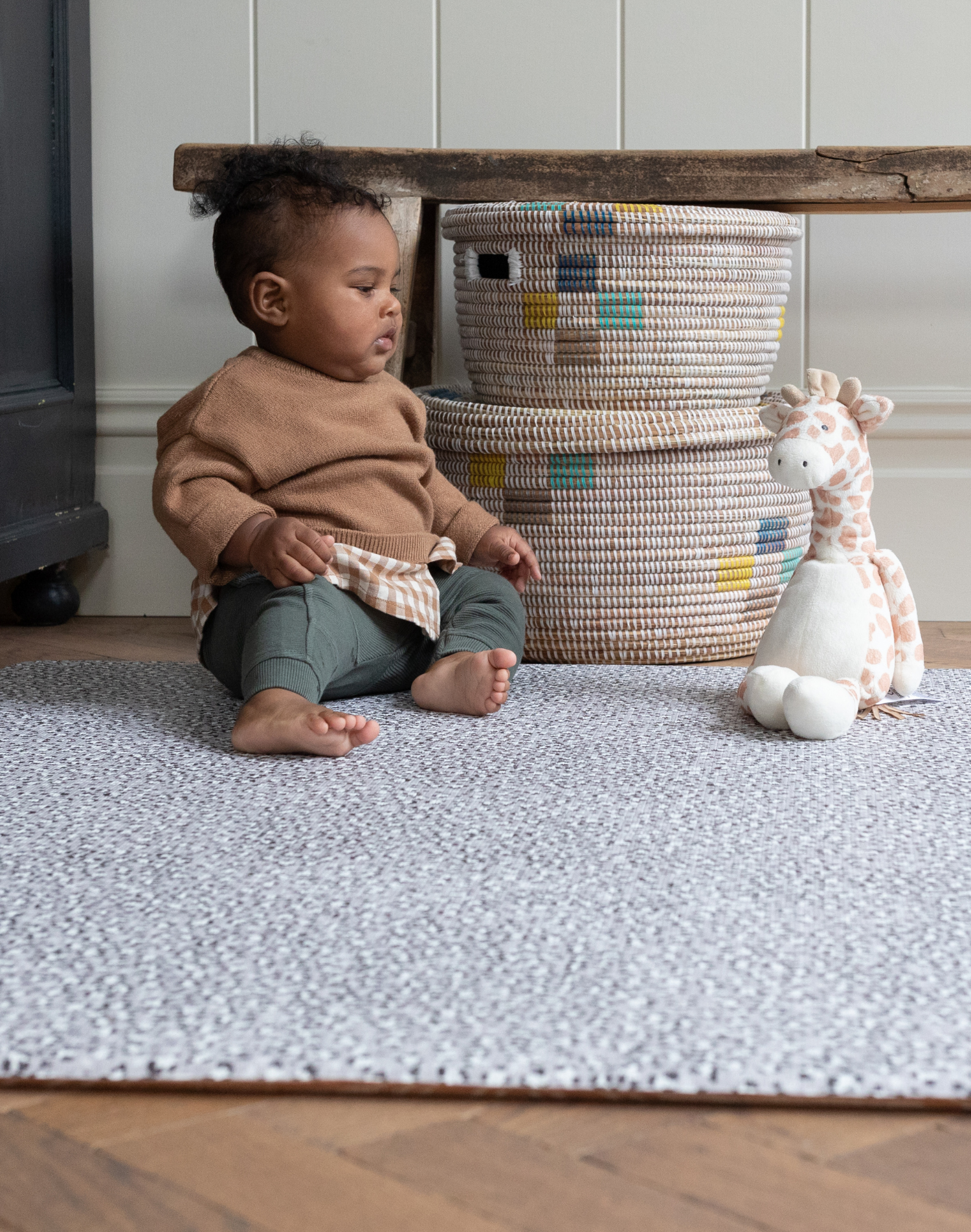 Baby boy plays on leopard print baby playmat designed with thick memory foam