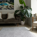 Modern family living room with grey playmat designed to look like a rug