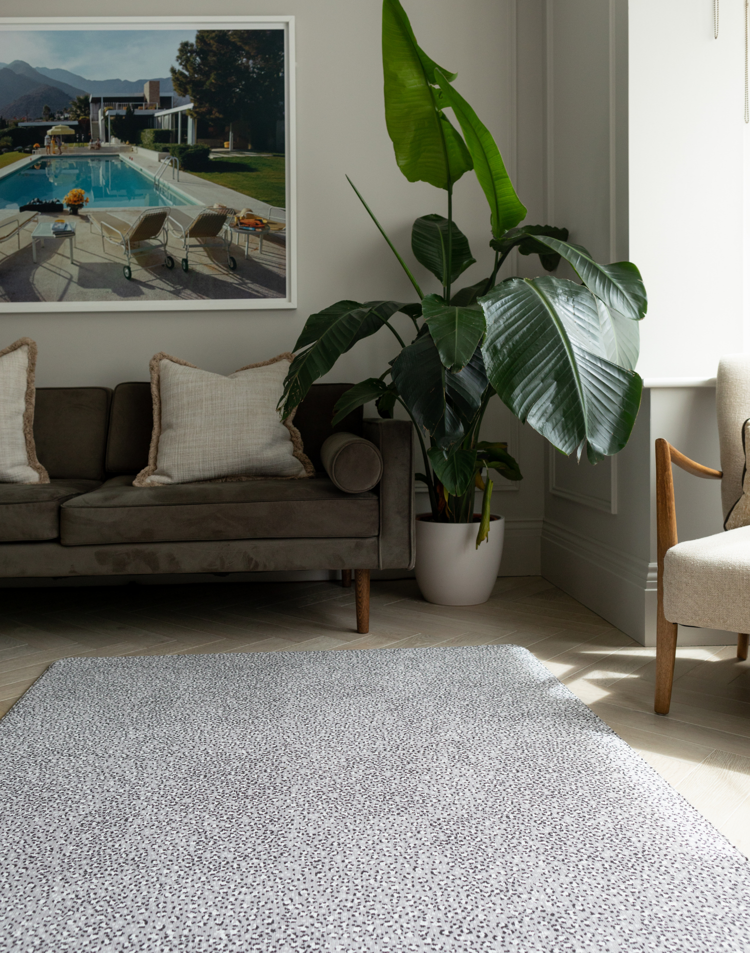 Modern family living room with grey playmat designed to look like a rug