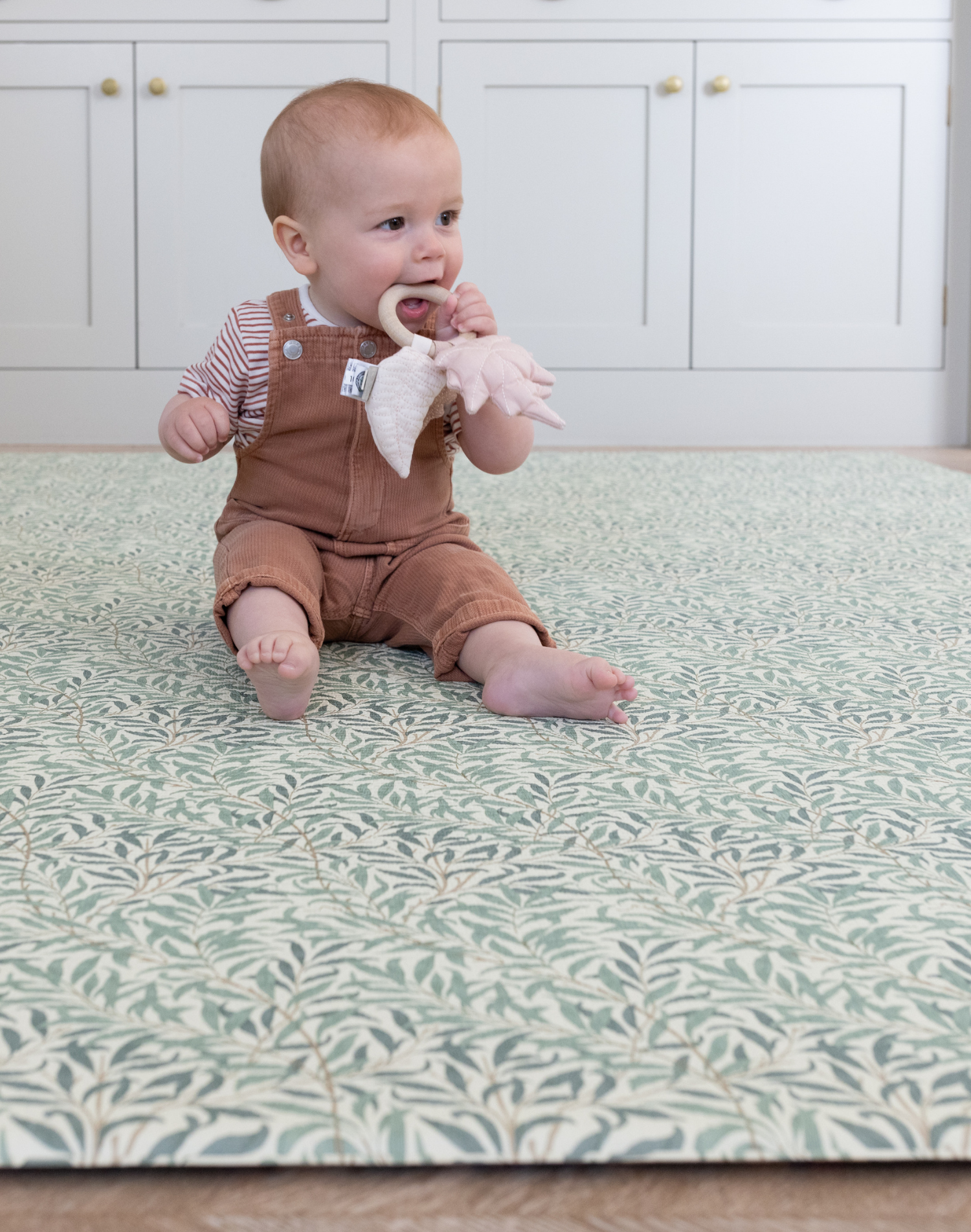 baby teething toy on totter and tumble playmat in collaboration with Morris & co. in heritage willow boughs print one piece playmat for toddlers