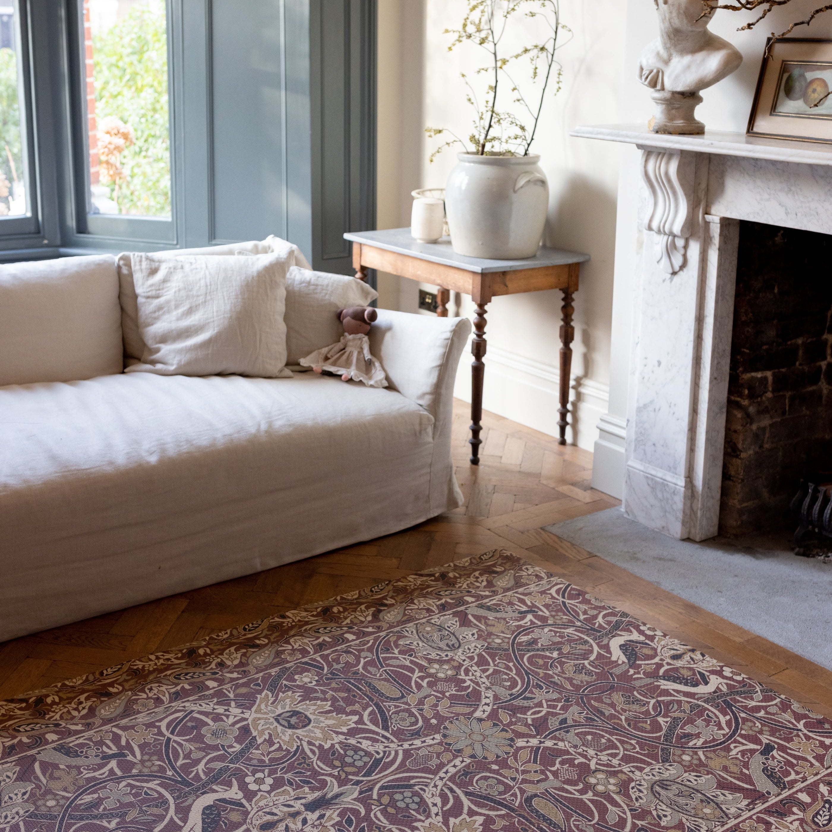 red and gold maximalist rug like play mat featuring morris & co. bullerswood design