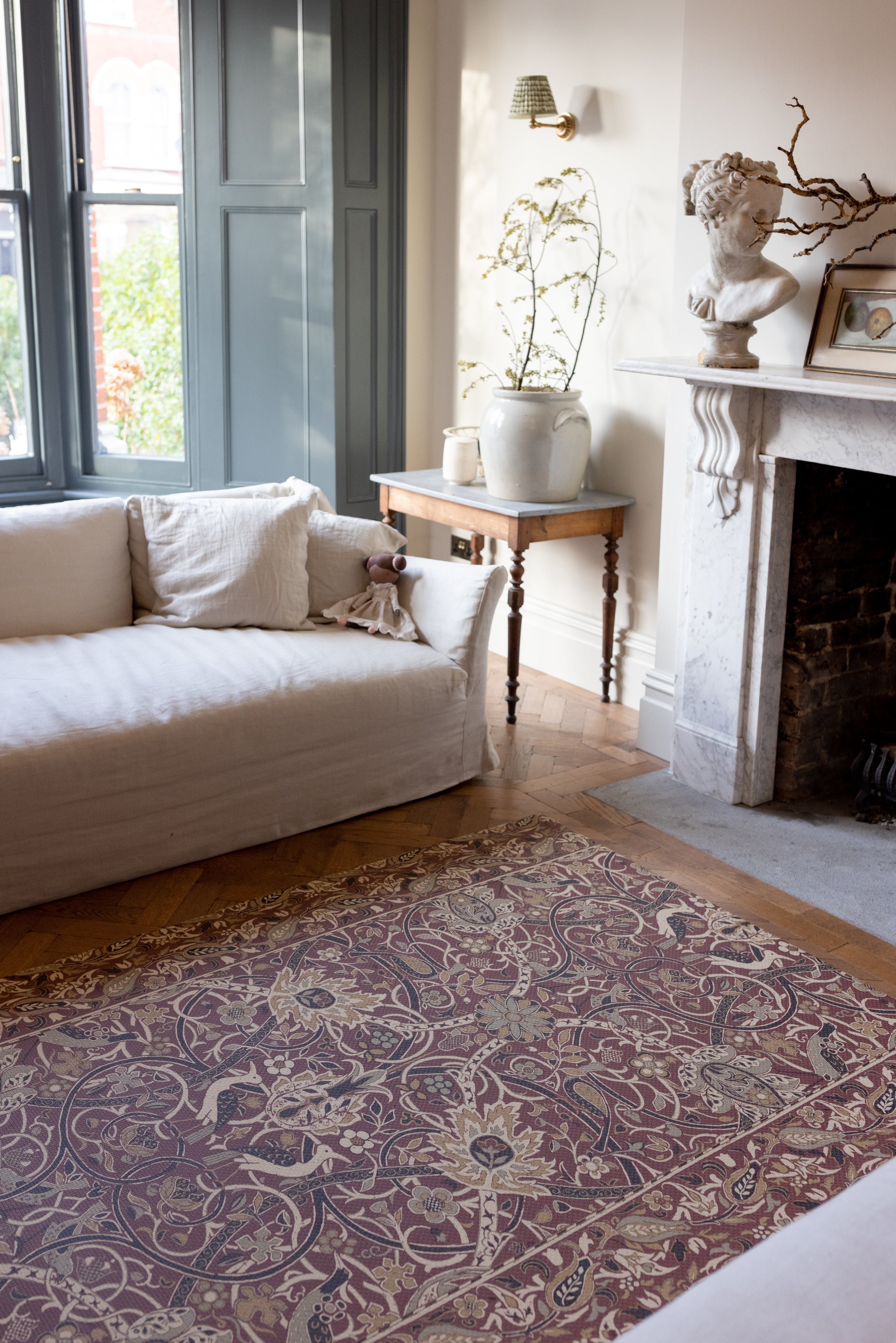 red and gold maximalist rug like play mat featuring morris & co. bullerswood design