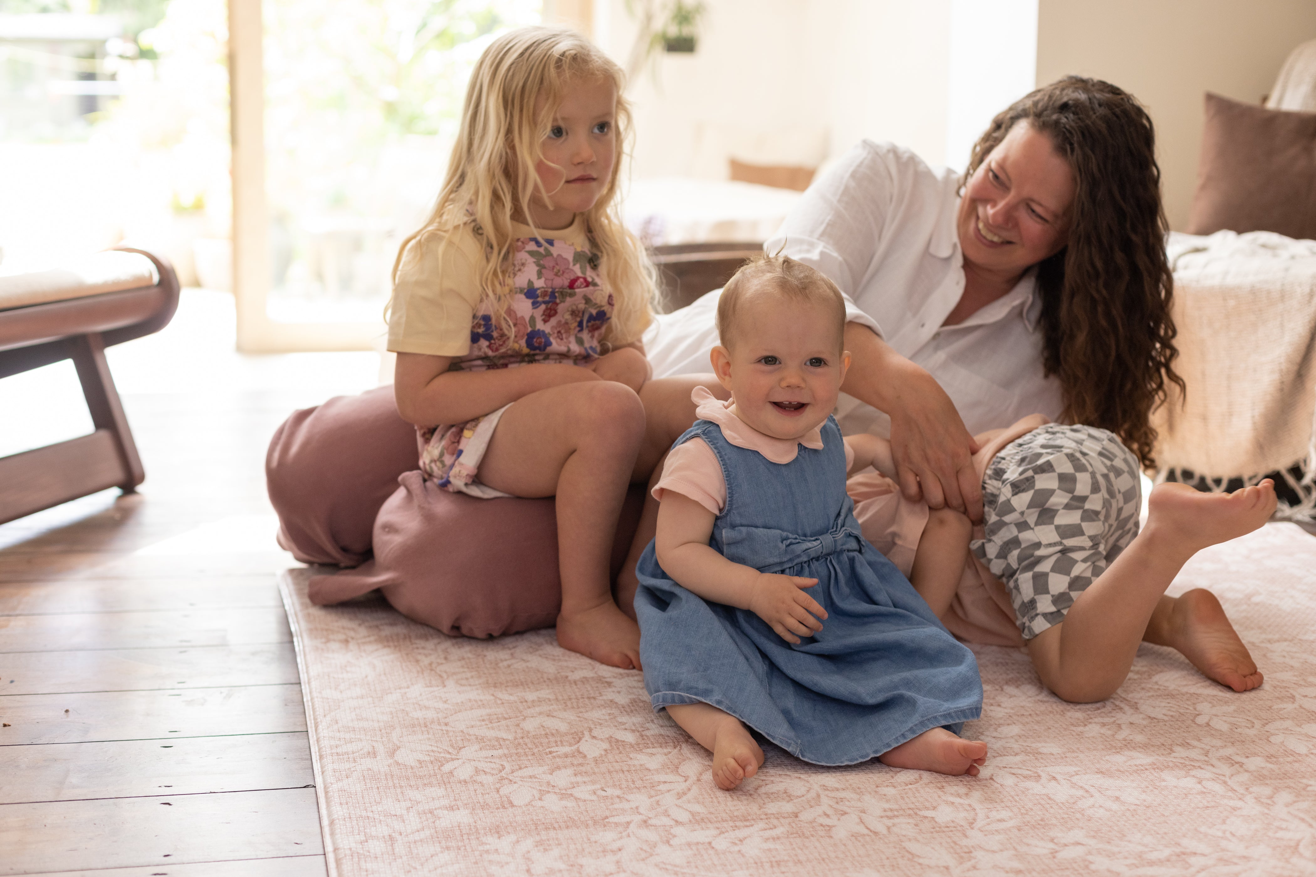 pink play mat family gathering totter and tumble