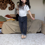 Child jumping on bedroom floor with cushioning padded playmat to soften her jumps! 