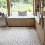Totter + Tumble playmat in compact size sitting in a corner of a kitchen with snug bench area for the whole family to enjoy