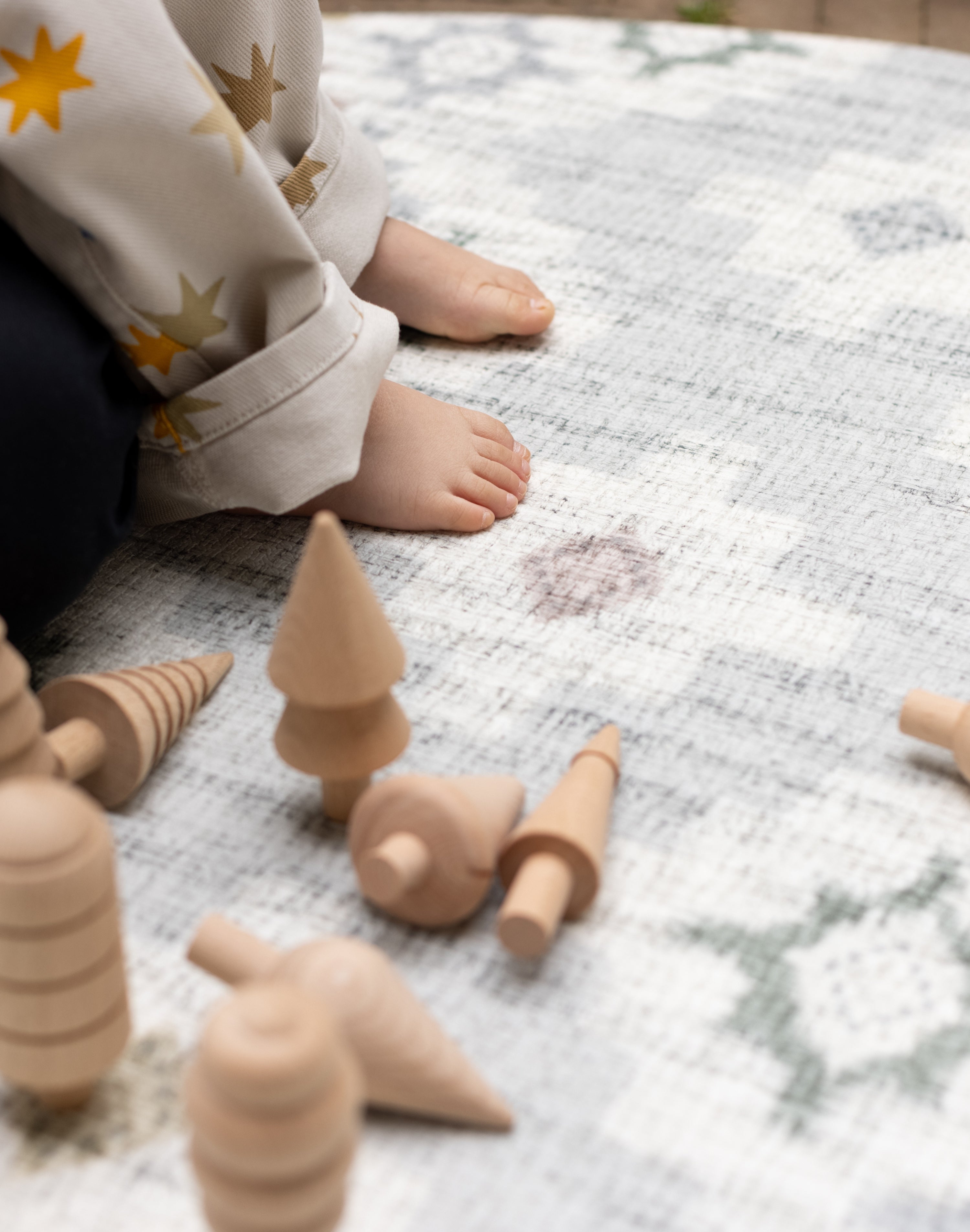 Wooden toys on an anti-slip textured surface great for little ones to play in a safe and stabe place 