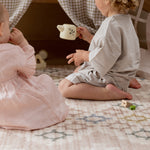 Children playing on a totter and tumble playmat