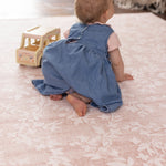 little baby crawling on totter and tumble pink Aster playmat 