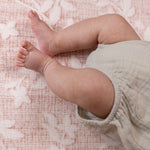 little baby legs resting on Totter and Tumble playmat neutral design for interior led home