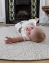 totter + tumble padded play mat in grey acorn design from william morris archive baby playing on floor mat comfy playmat for tummy time and rolling practise