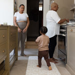 Wipe down kitchen runner mat in family house 