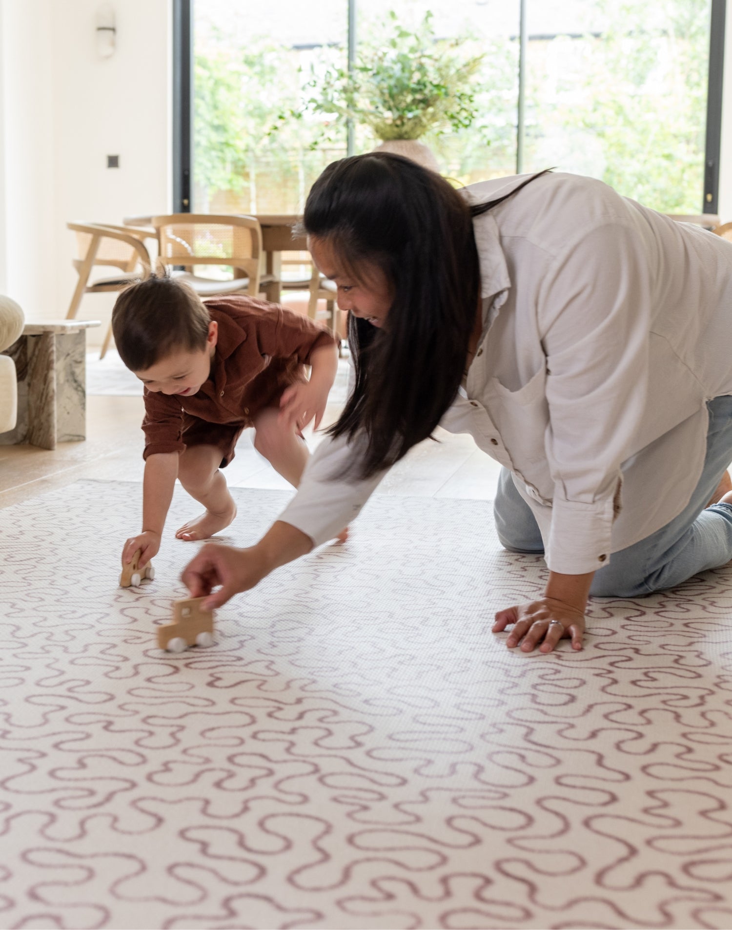 Mum and child play on The Brecon, a large baby play mat perfect for toddlers and newborns alike.