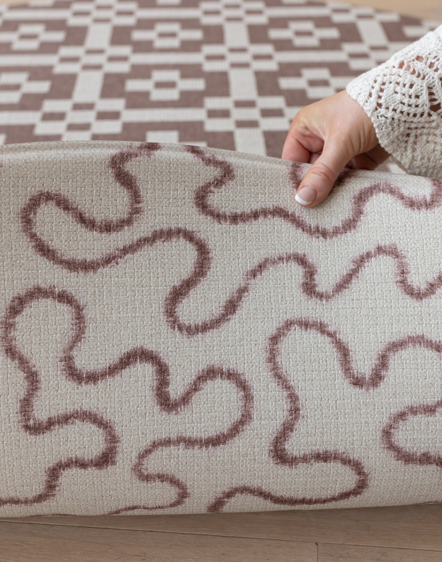 Close-up of the Brecon round baby playmat's tufted texture + abstract pattern, a nature-inspired playmat with heritage design