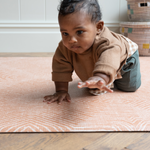 Brothers play on the terracotta tumble rug  by totter and tumble with a thick design to protect tumbles