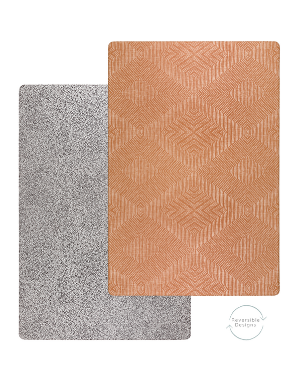 two sides of the reversible and padded play mat designed to support babies and look stylish in the modern family home 
