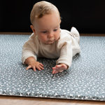 Baby tummy time on baby activity mat with a luxury padded memory foam design 