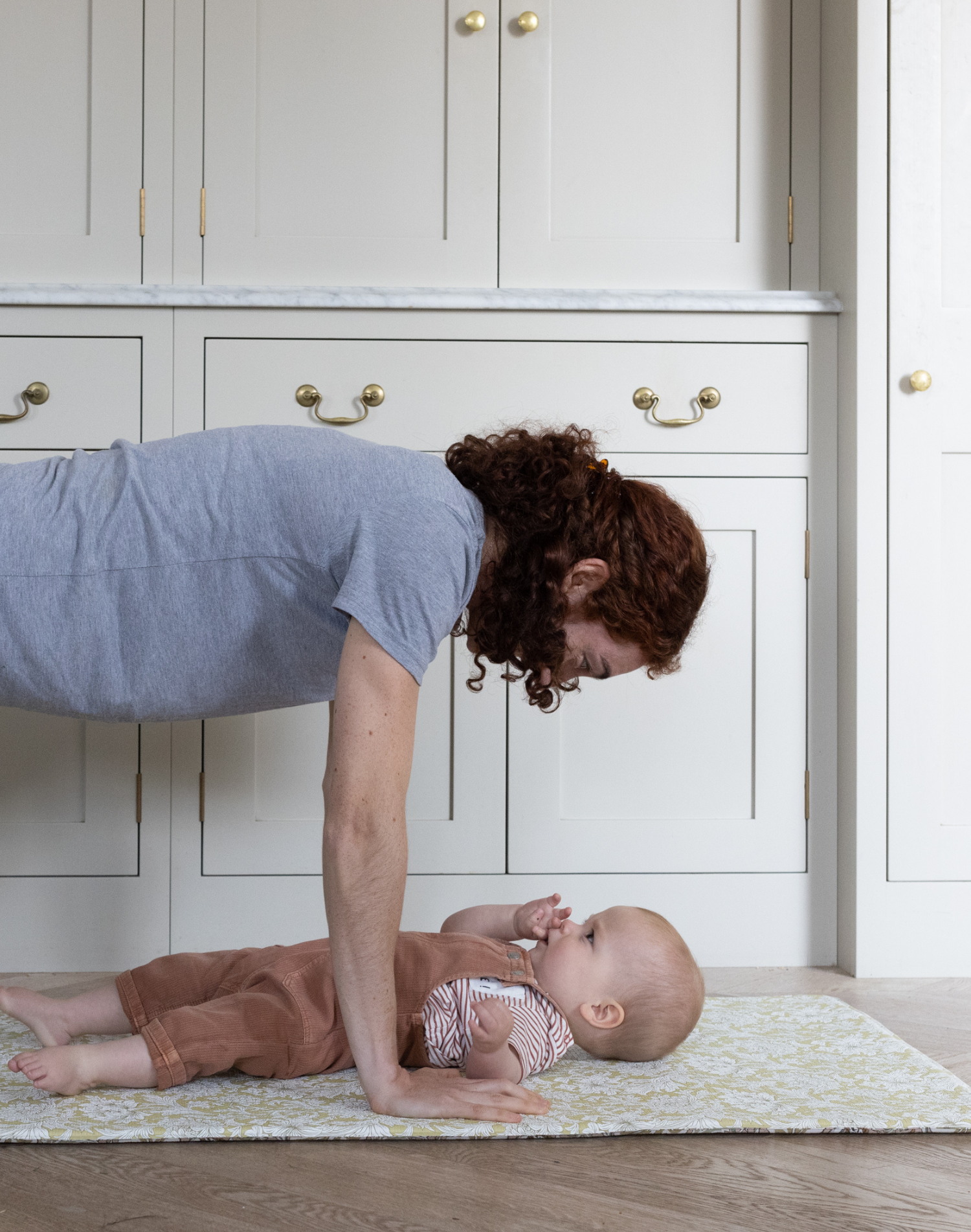 parent and baby exercising on play mat totter and tumble morris & co collection. Washable rug playmat runner