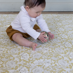 baby playing on play mat rug. morris & co playmats like totter and tumble are wipeable, easy to clean foam play mat padded to protect your little one from tumbling and the floor underneath. 