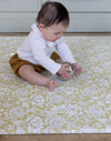 baby playing on play mat rug. morris & co playmats like totter and tumble are wipeable, easy to clean foam play mat padded to protect your little one from tumbling and the floor underneath. 