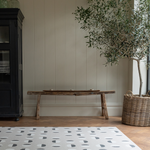 Monochrome play mat with organic polka design that complements contemporary family homes 