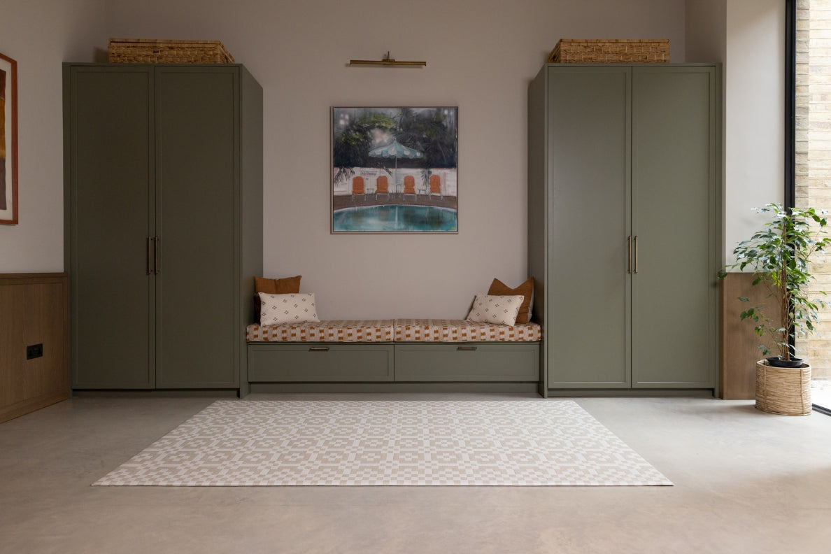 The Totter + Tumble Holbein playmat in a family living space