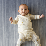 Baby laying on foam mat made for the whole family the navy play mat Kasuri by totter and tumble is perfect for stylish homes